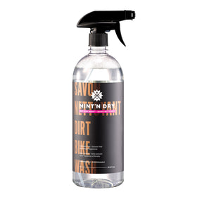 Clear spray bottle with black nozzle on a white background