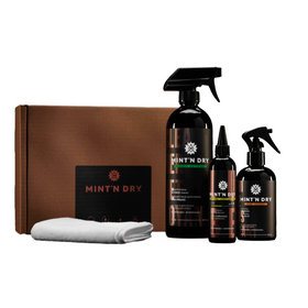 Mint 'N Dry grooming kit with bottles, a box, and a towel on a white background