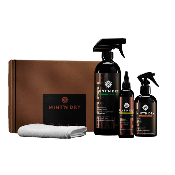Mint 'N Dry grooming kit with bottles, a box, and a towel on a white background